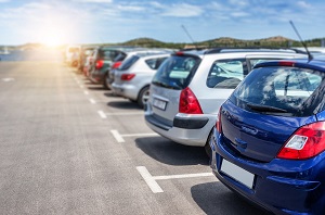 side view of cars in the parking lot | homeowners association parking rules