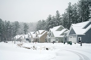 houses in residential community in winter | prevent frozen pipe
