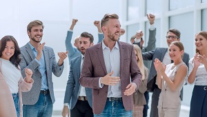 happy man surrounded by a group of people | responsibilities of an HOA president