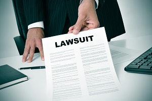 man in suit showing a document with the text lawsuit | legal action against hoarders