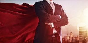 man in suit and red cape with crossed arms | successful hoa community
