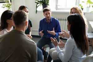 group of people gathered around having a discussion | hoa strategies