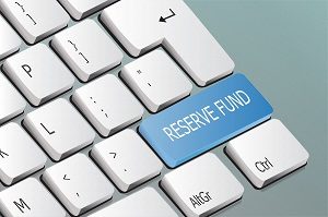 reserve fund written on the keyboard button | managing hoa reserve funds