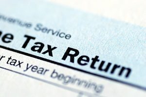 Close up view of the income tax return | property tax exemptions