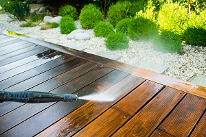 cleaning terrace surface with a power washer | improve curb appeal in your HOA