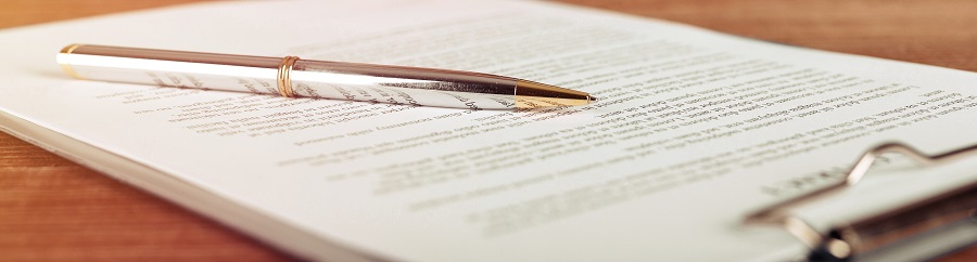Pen lying on a document | homeowner association bylaws