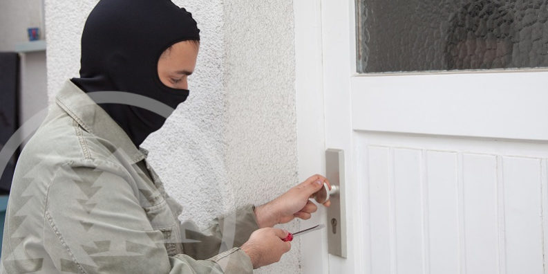 burglar unlocking door burglar unlocking door | crime prevention in an HOA
