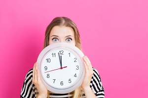 woman holding a clock | hoa repairs rules