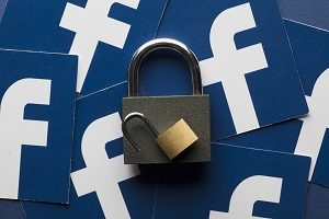 A set of padlocks with the facebook social media logo | use social media in HOA