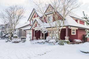 house covered in snow | hoa springtime landscaping