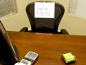 empty seat in office with 'gone fishing' note | difficult hoa board member