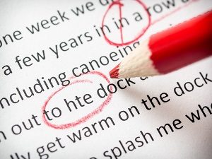 Proofreading text marked with red pencil | hoa newsletter template