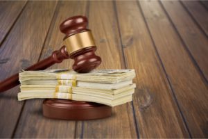 gavel with money | can an HOA fine you